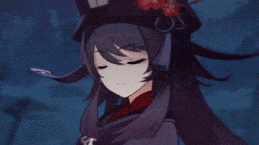 a close up of a girl wearing a hat with a heart on it .