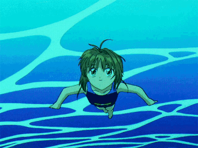 a girl in a bathing suit is swimming in a blue pool