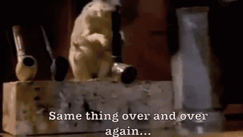 a cat is sitting on top of a wooden box with the words same thing over and over again ..