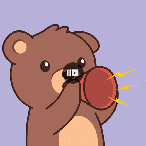 a brown teddy bear is holding a red object in its mouth with a video playing in the background