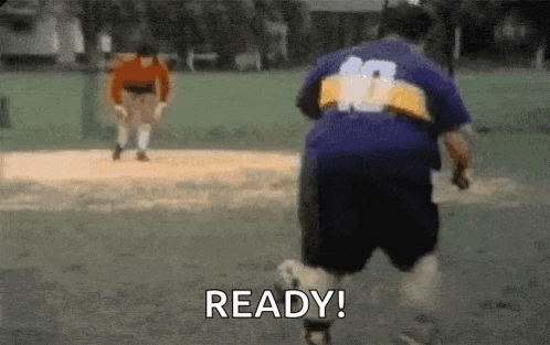 a man is running with a soccer ball on a field and the word ready is visible .