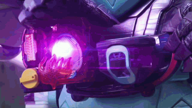 a close up of a purple object with a light coming out of it .