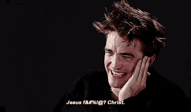 a man is laughing and saying `` jesus f & # % @ ? christ . ''