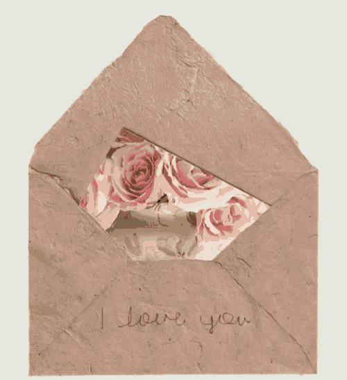 an envelope with a piece of paper in it that says i love you on it