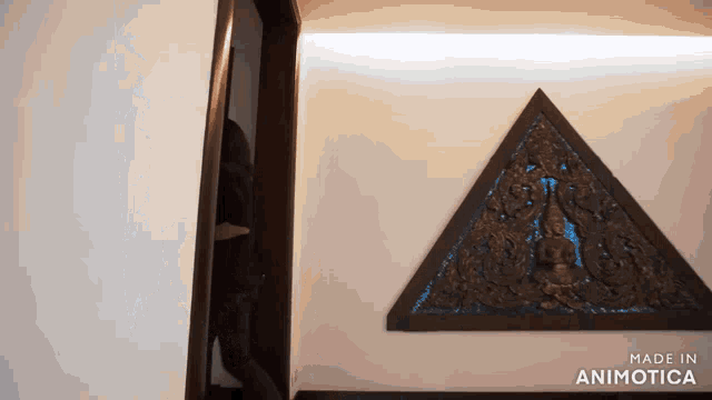a triangle on a wall that says made in animonica
