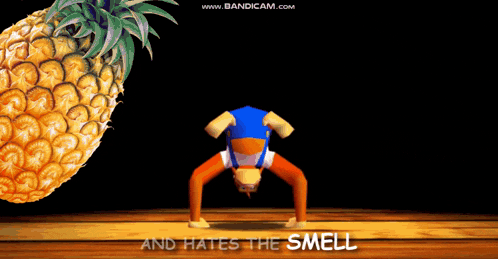a man in a blue shirt is doing a handstand with the words he 's the last member below him