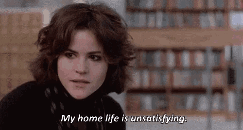 a woman is sitting in a library and saying `` my home life is unsatisfying '' .