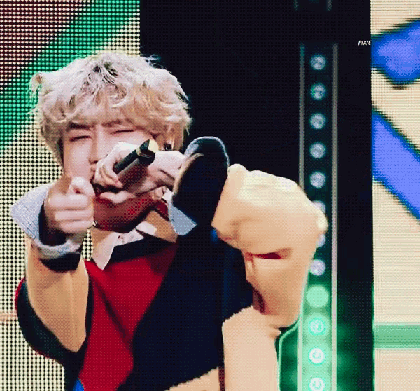 a man holding a microphone and pointing at the camera with a fox logo in the upper right corner