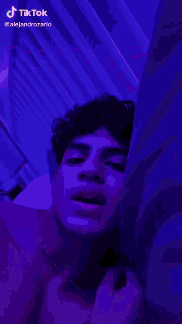 a purple background with a tiktok logo on the bottom right