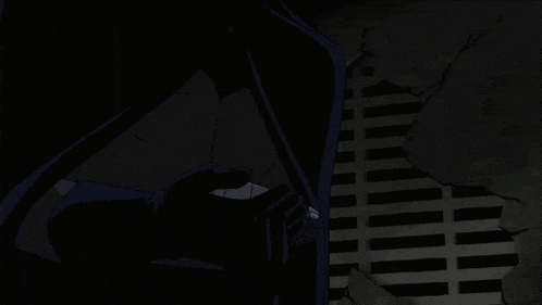 a person holding a gun with a black glove behind them