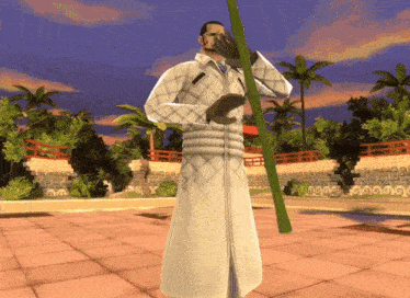 a man in a white robe holds a green stick