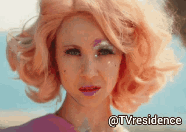 a close up of a woman 's face with the words @tvresidence on the bottom