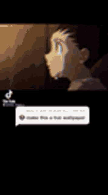 a close up of a person 's face with a speech bubble .