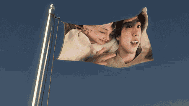 a flag that has a picture of a man and a woman on it