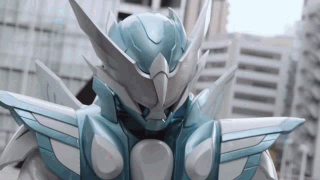 a close up of a robot 's head with wings