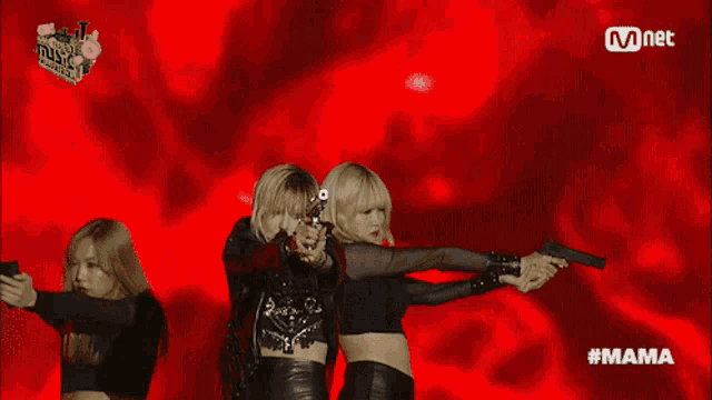 two women holding guns in front of a red background that says mama