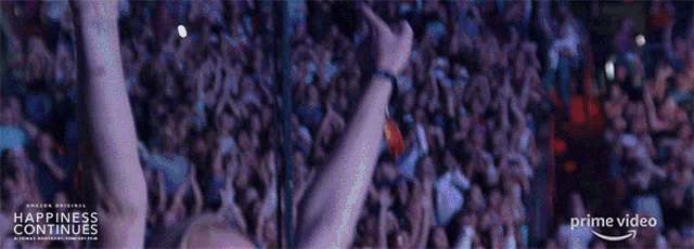 a crowd of people are watching happiness continues