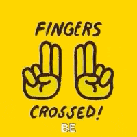 a yellow background with two fingers crossed on it .