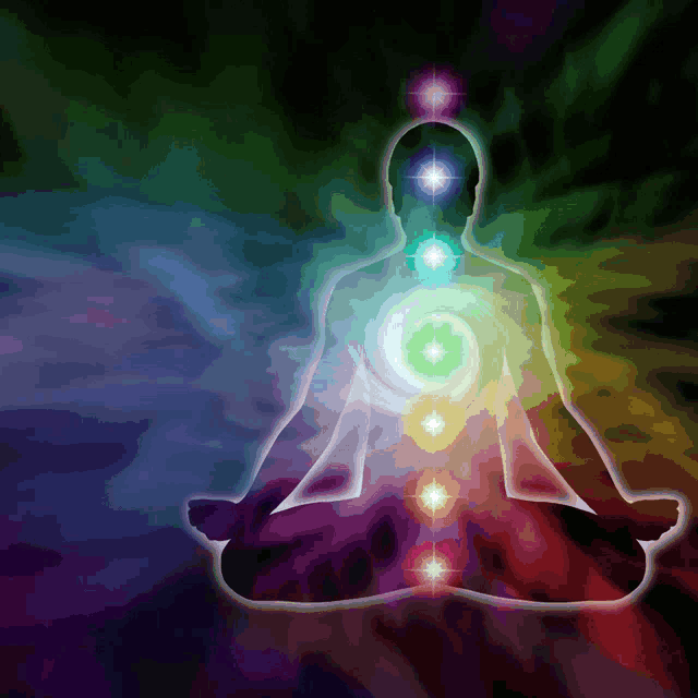 a silhouette of a person sitting in a lotus position with chakras