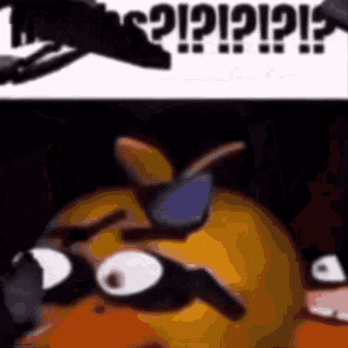 a close up of a cartoon character wearing sunglasses with a blurred background .
