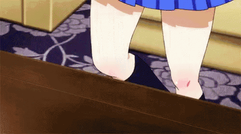 a girl in a blue skirt and white socks is standing on a staircase