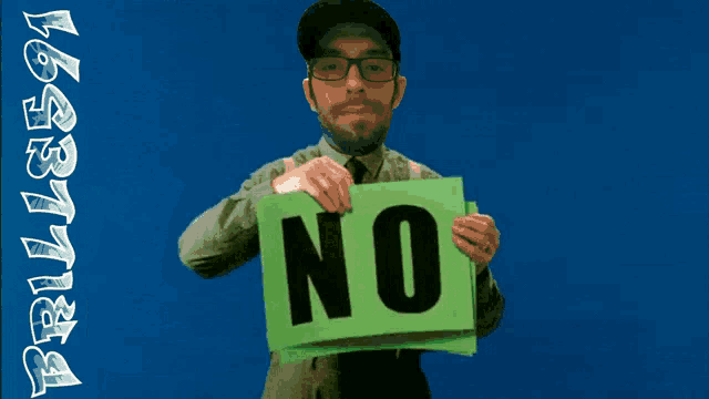 a man holding a sign that says no on it