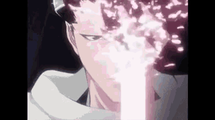 a close up of a person 's face with a light coming out of his mouth .