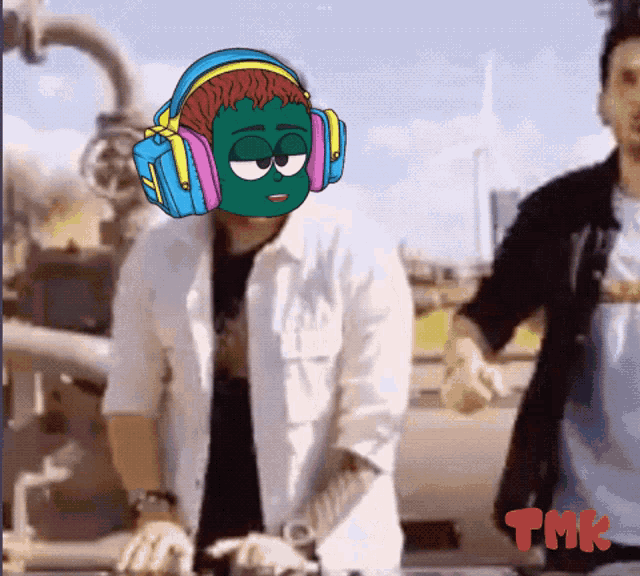 a man wearing headphones with a cartoon character on his face and the word tmk on the bottom