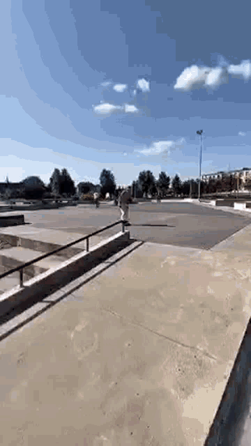 a person is doing a trick on a skateboard in a skate park .