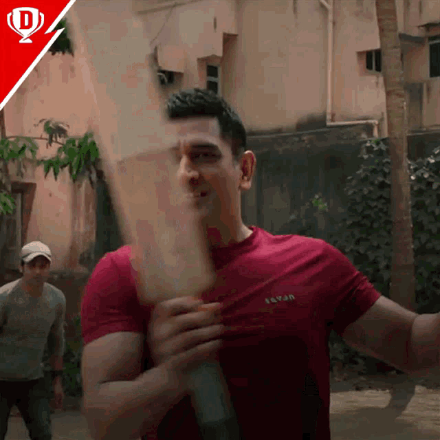 a man in a red shirt with the word savan on the front
