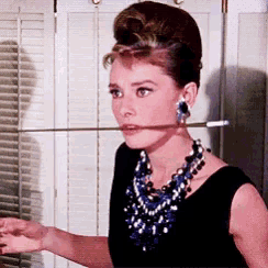 a woman with a stick in her mouth