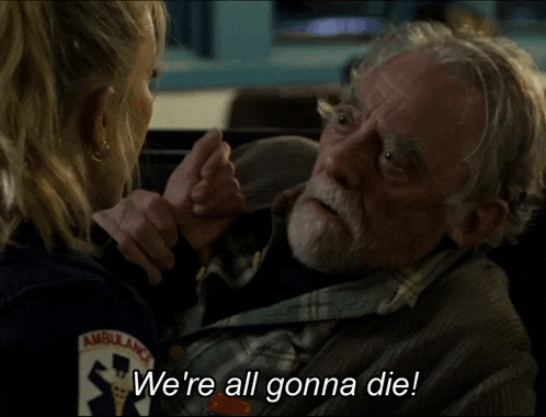 a man with a beard is talking to an ambulance worker