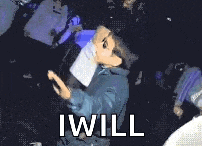 a young boy wearing sunglasses is standing in a dark room with the words i will above him .