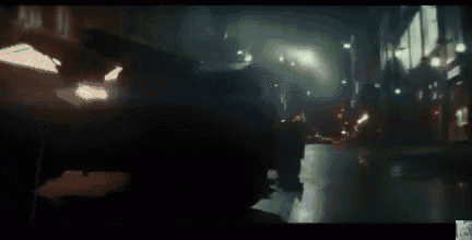 harley quinn is standing on the balcony of an elevator in suicide squad .