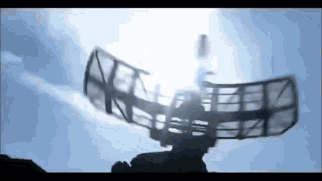 a radar is flying through the air in the sky .