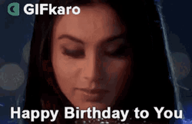 a close up of a woman 's face with the words `` happy birthday to you '' .