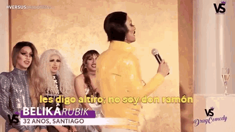 a woman in a yellow jacket is singing into a microphone