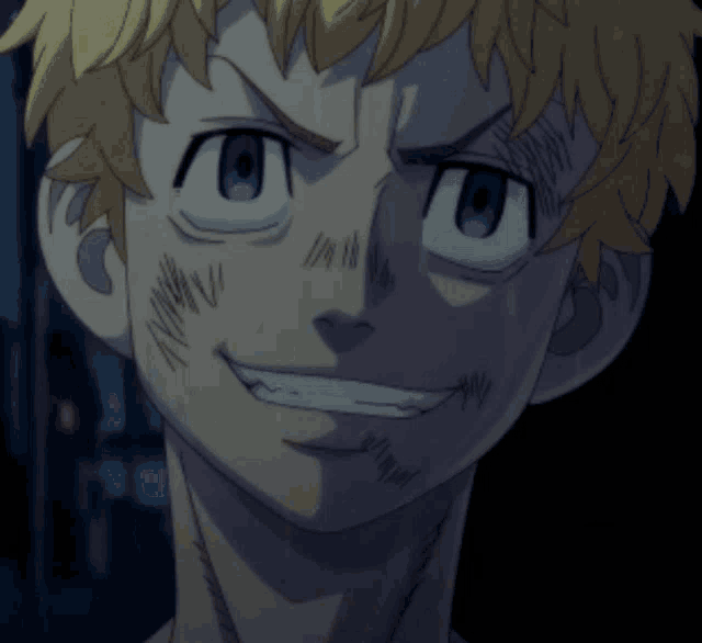 a close up of a man 's face with a smile