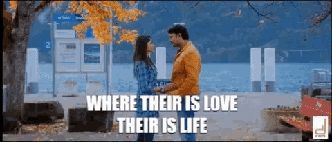 a man and a woman are standing next to each other with the words where their is love their is life