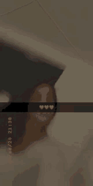 a woman is laying on a bed with her head on a pillow .