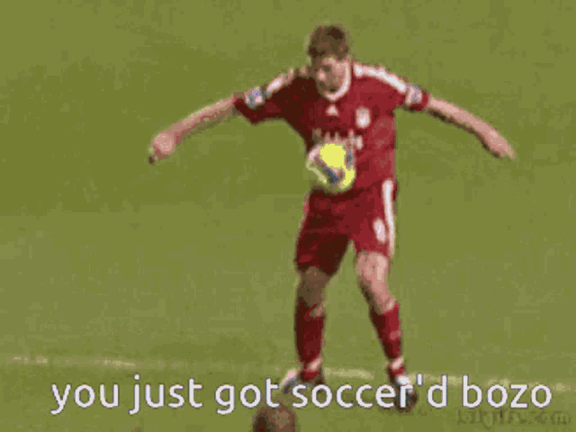 a soccer player with the number 21 on his shirt is kicking the ball