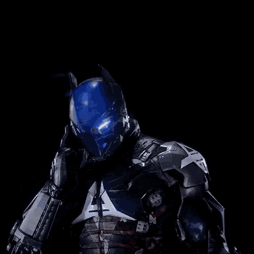 a close up of a person in a batman costume with a blue helmet