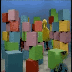 a bunch of colorful blocks are stacked on each other