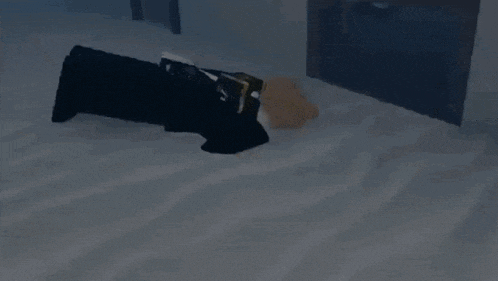 a person is laying on a bed with a pillow and a book .