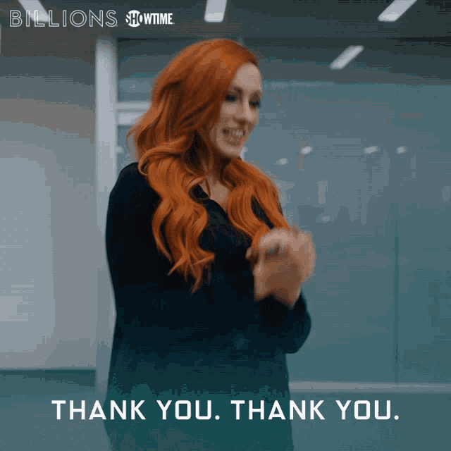 a woman with red hair is clapping her hands and the words thank you thank you are below her