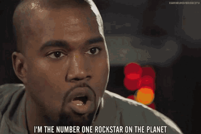 a man with a beard is saying " i 'm the number one rockstar on the planet "
