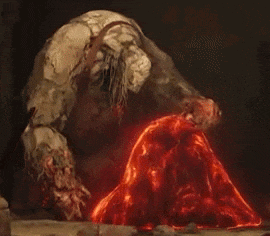 a monster is standing next to a pile of magma