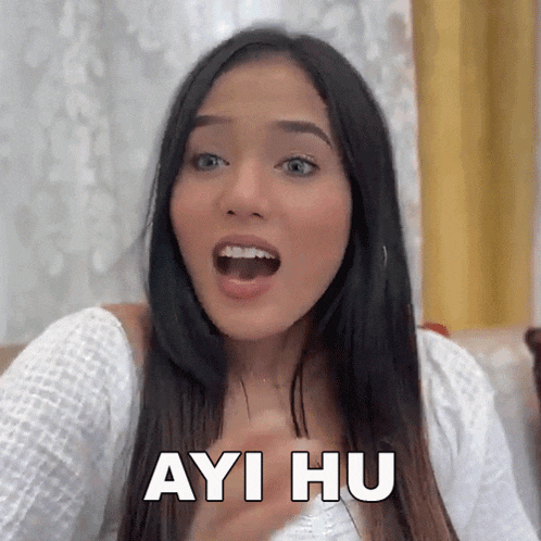 a woman with a surprised look on her face and the words " ayi hu " on her chest