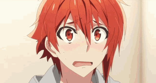 a close up of a person with red hair and red eyes