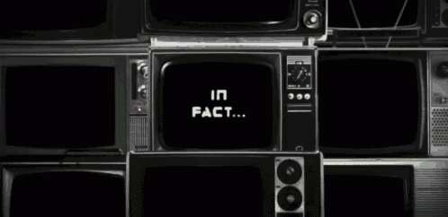 a bunch of old televisions are stacked on top of each other with the words in fact on the screen